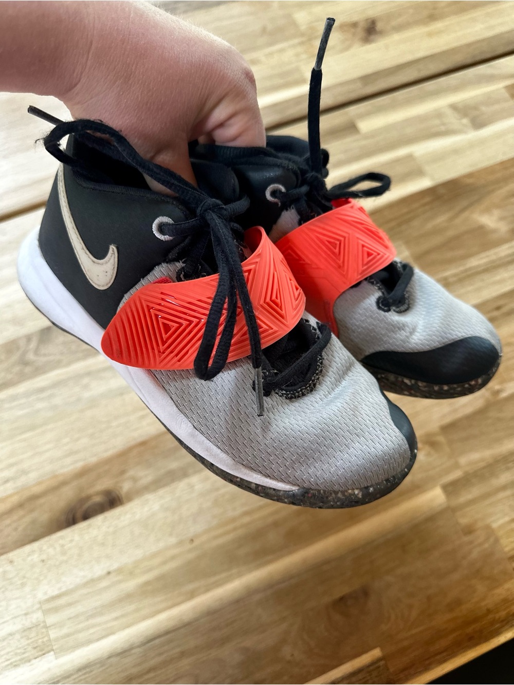 Nike Kyrie 4 sneakers in gray, black, and orange